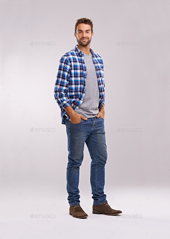 Rugged and manly. Studio shot of a handsome man against a gray background.