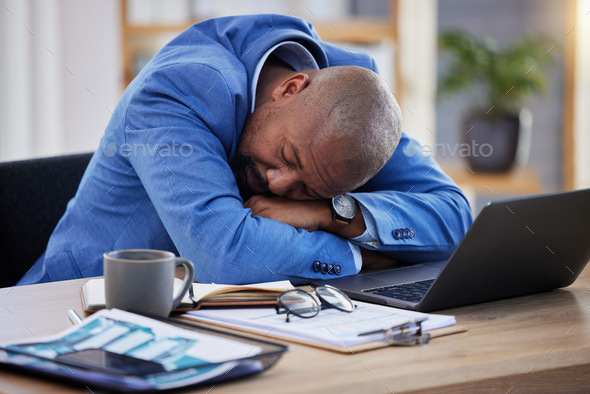 Tired, professional burnout and black man sleep at desk, mental health and depression with sick bus