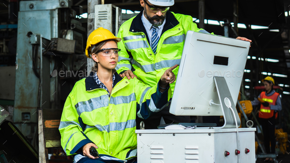 woman worker controller point to screen of computer explaining machine ...