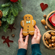 Female hands holding gingerbread man - PhotoDune Item for Sale