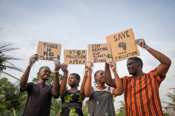 Youth holding signs with written: there is no planet b, stop pollution in africa