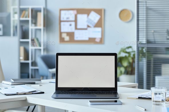 Open laptop on desk with white screen mock up Stock Photo by ...