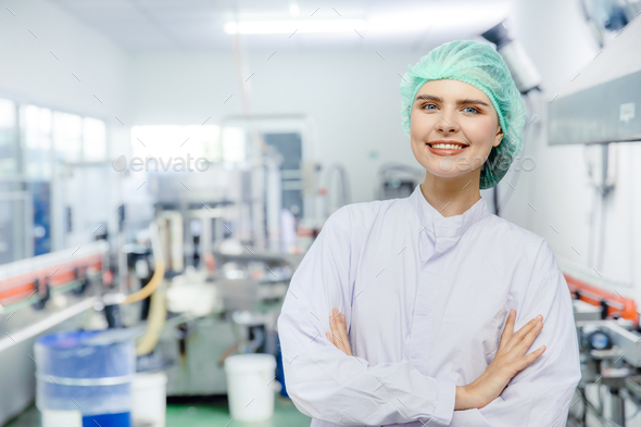 portrait woman staff worker in food and drink industry production line beverage factory happy smile