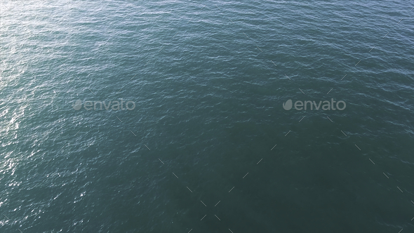 Aerial view of calm sea or ocean water surface, natural background. Stock. Top view of clean ocean