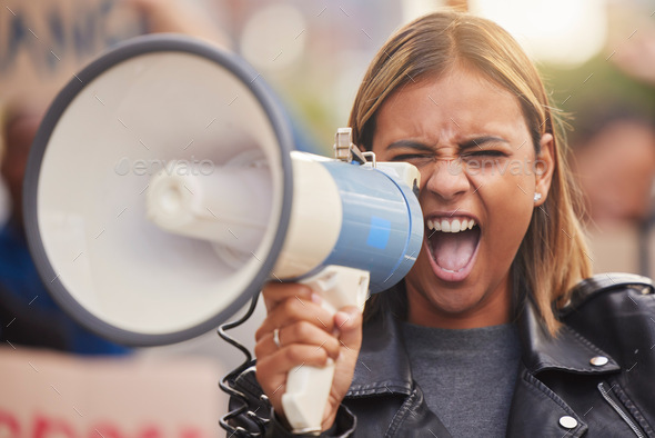 Megaphone, woman and shouting for social change, humanity and justice for equality, on street and