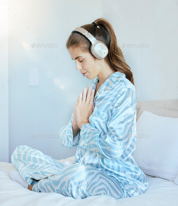 Woman, music headphones or namaste meditation in house bedroom, home or hotel for mental health, st