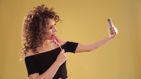 Woman Taking Selfie and Posing on Camera