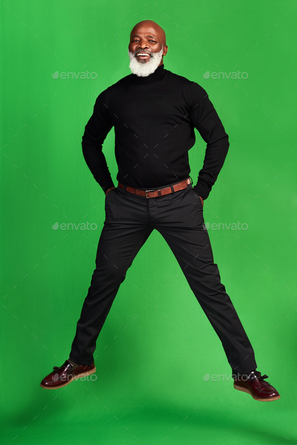 Never stop living your best life. Studio shot of a senior man posing against a green background.