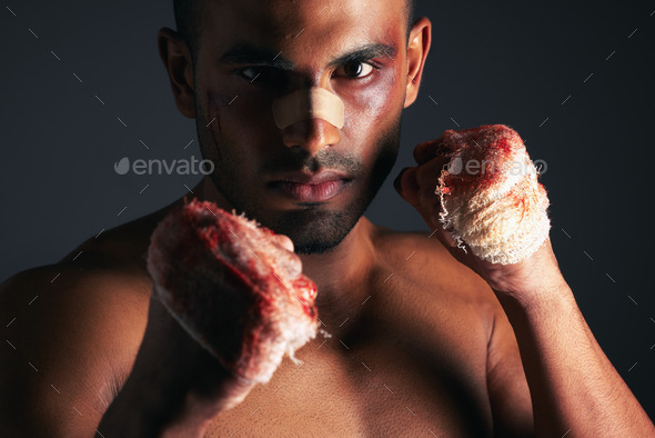 Man, face and blood fist fight with first aid bandages for fighting injury after boxing match. Angr