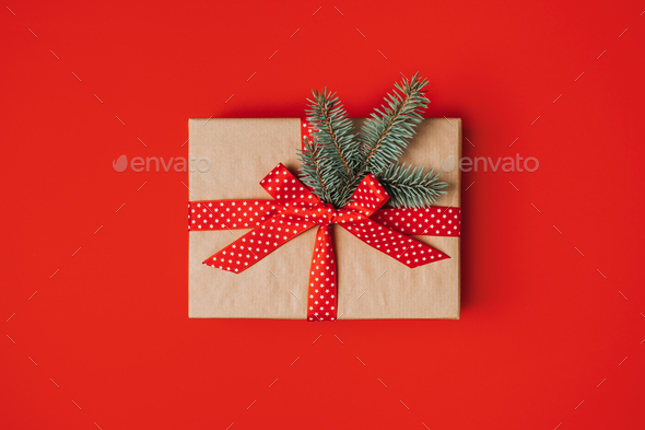 Subscription Gift Box, Care package with red ribbon on red background.