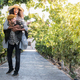 happy young interracial couple on holiday in a vineyard - PhotoDune Item for Sale