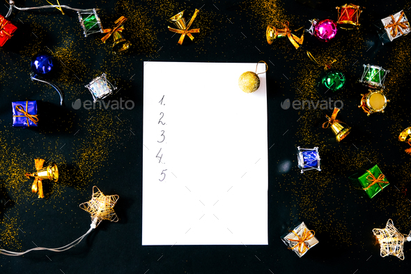 Blank sheet of paper and Christmas decorations. List of goals.