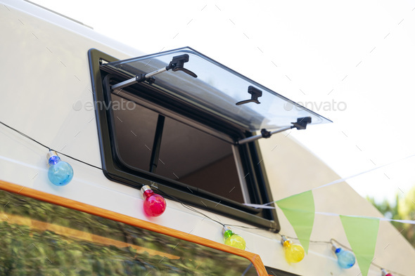 Open window of the camper van for recreation. Van life concept.