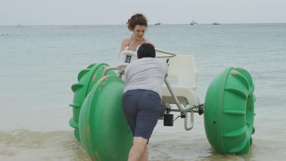 Couple on water tricycle in Hawaii