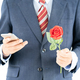 Businessman in suit holding smartphone and red rose - PhotoDune Item for Sale