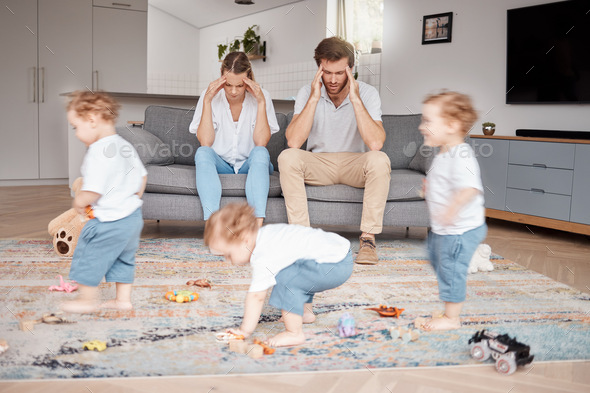 Parents, stress and busy with an adhd child running around a home living room with energy or motion