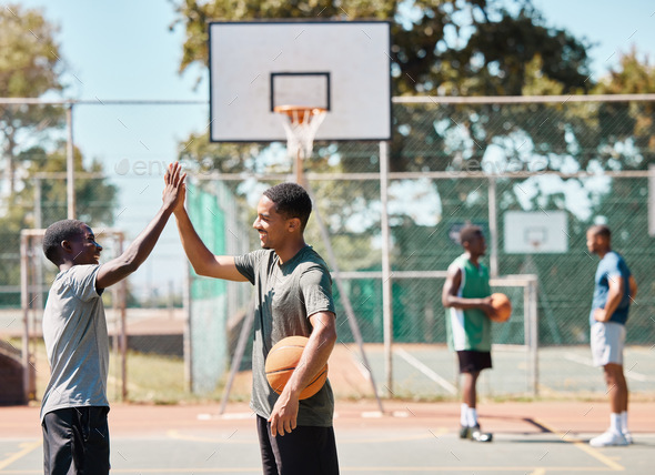 Basketball court, high five and team sports, success and support, winners and achievement outdoor. - Stock Photo - Images