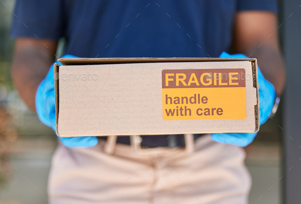 Courier, delivery and box with label for fragile goods, handle with care and shipping closeup, safe