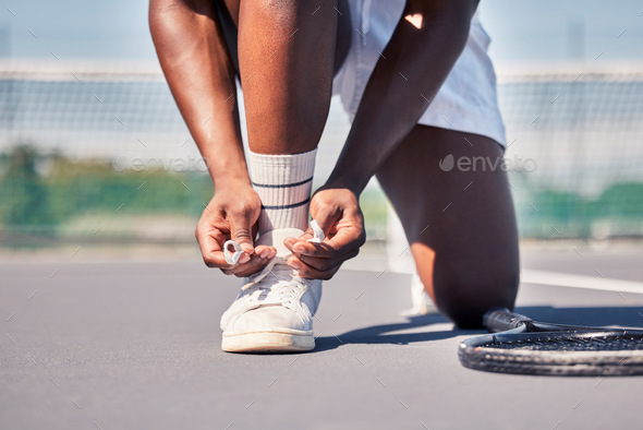 Sports, tennis and man tie shoes before game start, competition or fitness exercise on outdoor tenn
