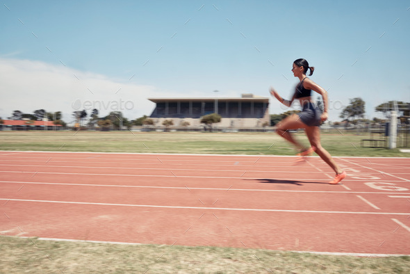Woman, fast runner and sports on stadium track for marathon training or exercise wellness. Athlete