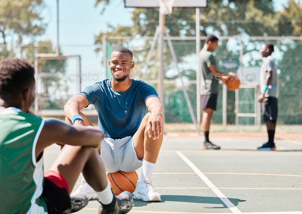 Basketball, team sports and social conversation at the court for break after fitness, training or e - Stock Photo - Images