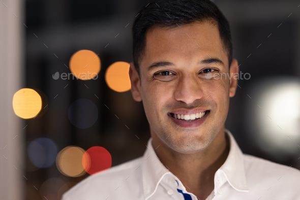 Business man portrait, smile and night working of a accountant worker ready for late financial job.