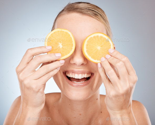 Lemon, eyes and skincare woman in studio for cosmetics, makeup and health of nutrition benefits and