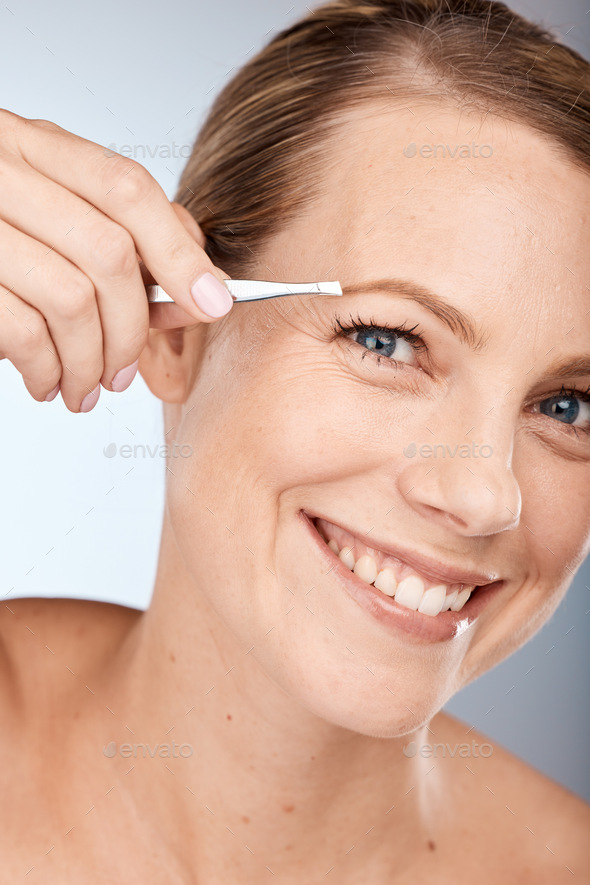Portrait of woman, tweezers and eyebrow hair removal for clean cosmetics, face and beauty on studio