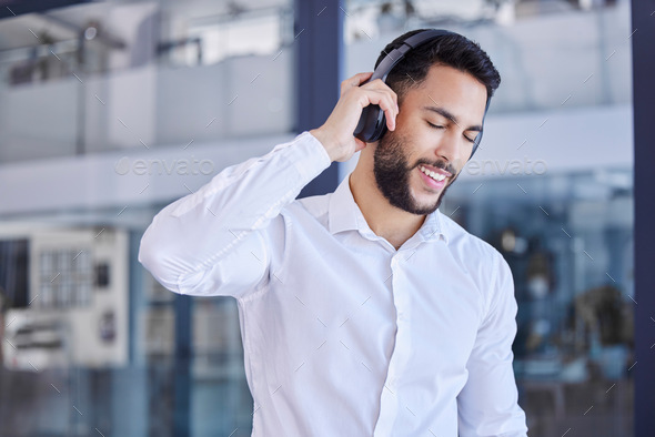 Business man, headphones and listening to music in office for motivation, inspiration or freedom on