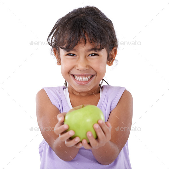 Portrait of an adorable little girl smiling and holding an apple Stock ...