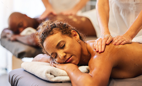 Black couple massage, spa and relax with oil on vacation, holiday or retreat together for bonding,