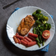 Grilled chicken and vegetables saute in a plate.  - PhotoDune Item for Sale