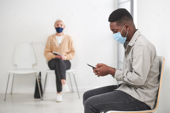 Patients In Masks Waiting In Corridor - Stock Photo - Images