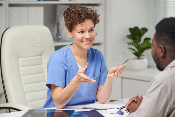 Cheerful Female Doctor Working - Stock Photo - Images