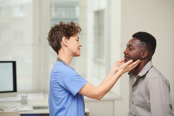 Doctor Examining Lymph Glands - Stock Photo - Images