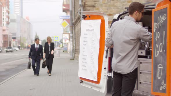 Multiethnic Businesspeople Walking by Mobile Coffee Van in Street alt