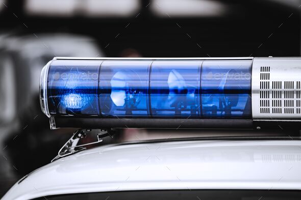 Blue light on top of a police car Stock Photo by wirestock | PhotoDune