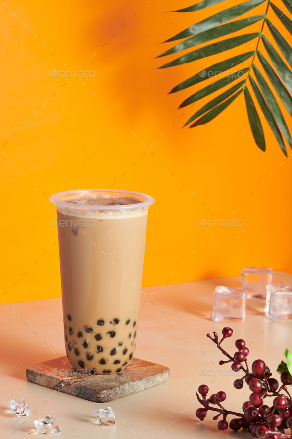 Home Made Milk Bubble Tea In A Transparent Glass On The Coaster On