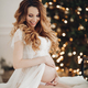 Charming pregnant woman poses for the camera in white dress on the bed - PhotoDune Item for Sale