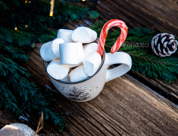 hot Christmas drink with marshmallow on wooden table - Stock Photo - Images