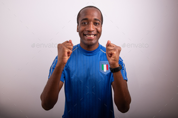italian fan is happy for the victory of italy, fan celebrating, afro italian boy