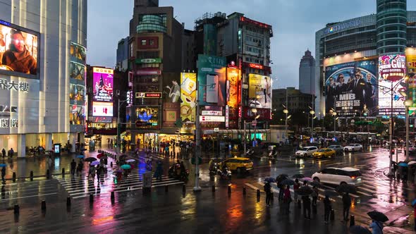 day to night time lapse of Ximending with falling rain in Taipei, Taiwan