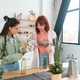 Two young women make bouquets at home in the kitchen - PhotoDune Item for Sale