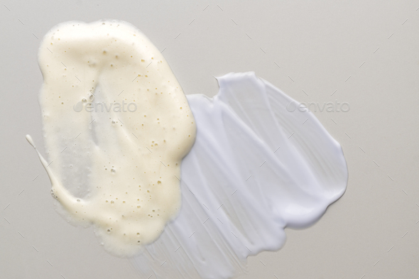 cosmetic smears of creamy textures om beige background. Skin care smears. Lotion, facial cleanser