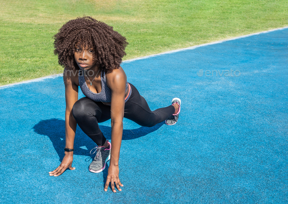 Black woman, running track and stretching in fitness workout