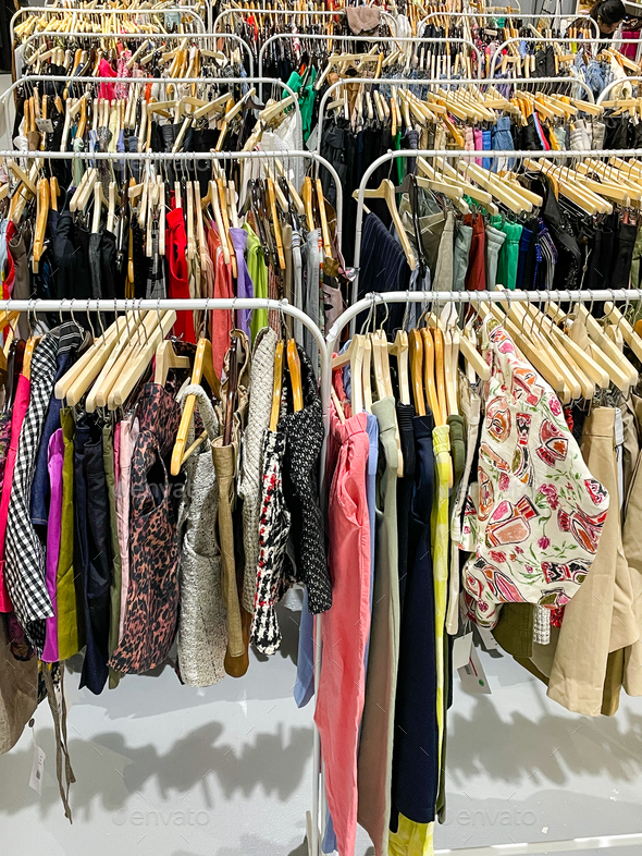 Clothes on the hangers at the sale - Stock Photo - Images