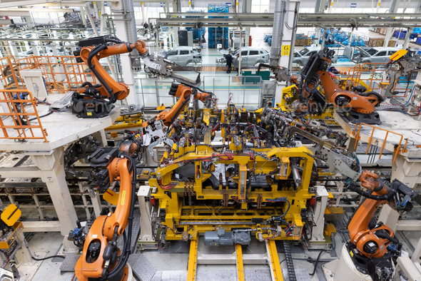 Car bodies are on assembly line. Factory for production of cars. Modern ...