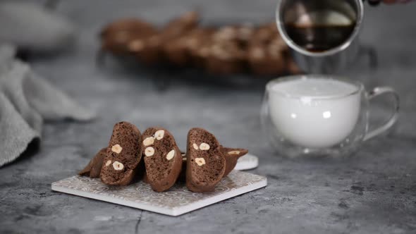 Chocolate Biscotti with Hazelnut and Cup of Coffee Latte