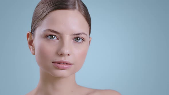 Headshot of Attractive Young Woman Looking to Camera and Moving Her ...