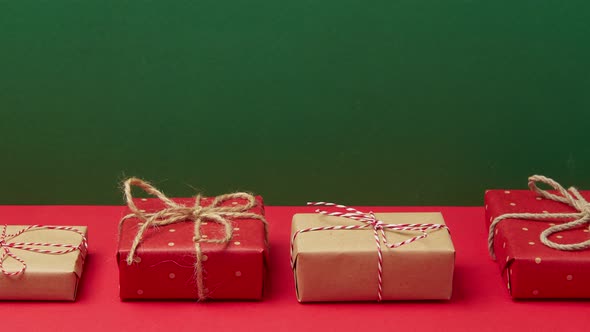 Stop Motion Animation with Christmas New Year Gift Boxes Moves on Red Background alt